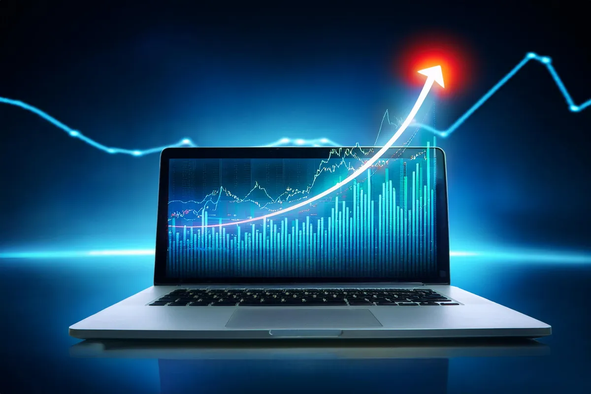 A laptop with a rising price graph 3