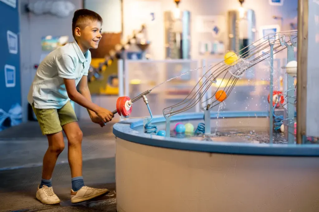 little-boy-playing-in-a-science-museum