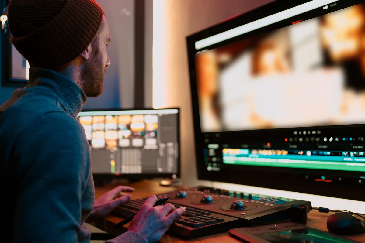 male-video-editor-working-on-his-personal-computer-