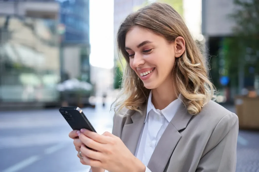 portrait-of-smiling-businesswoman-chat-in-app-