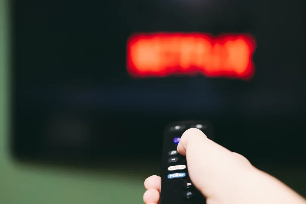woman-using-remote-control-to-switch