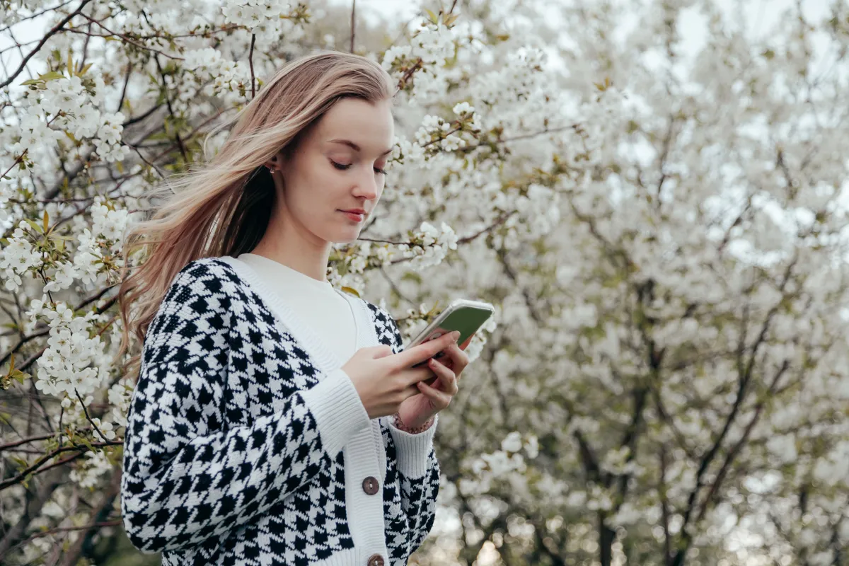 young-caucasian-blonde-woman-using