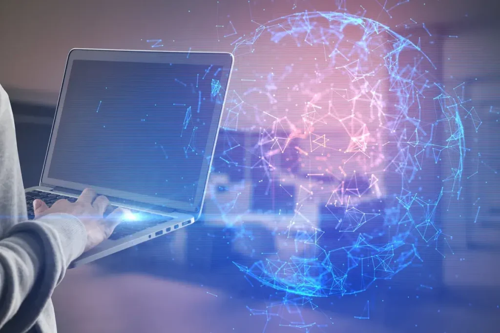 close-up-of-hand-with-laptop-and-abstract