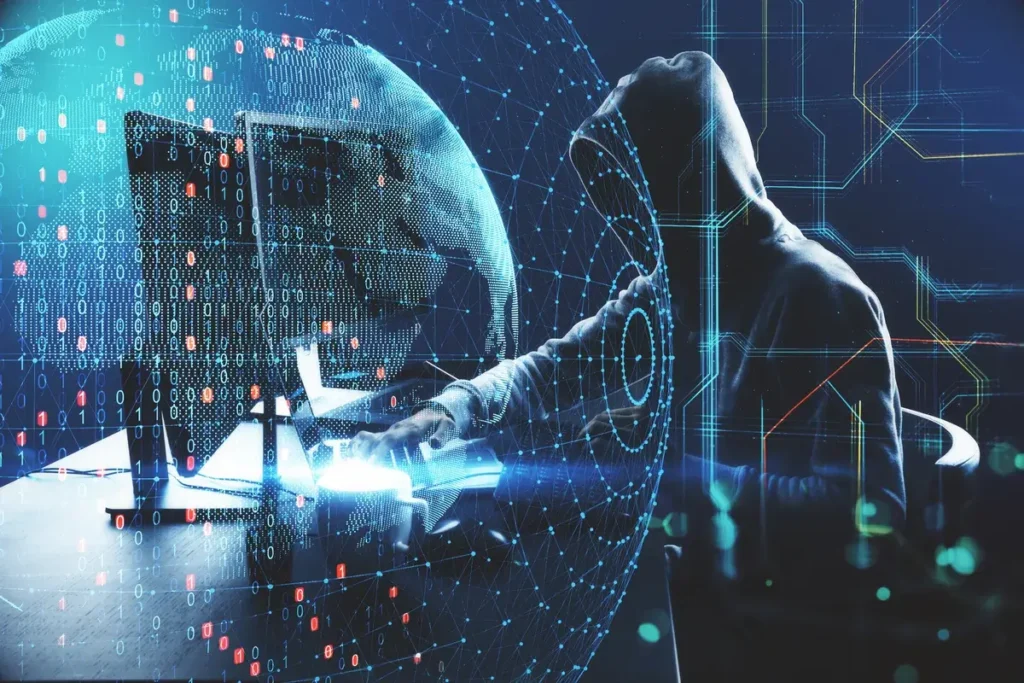 hacker-at-desktop-using-laptop-and-compute