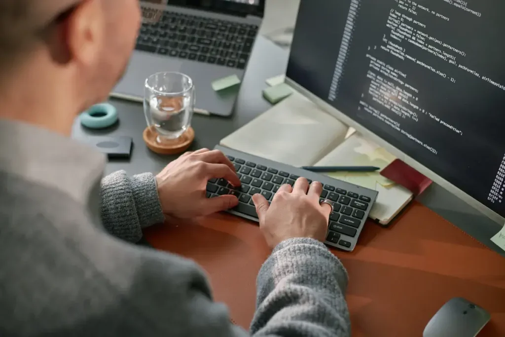 young-adult-caucasian-man-coding-software