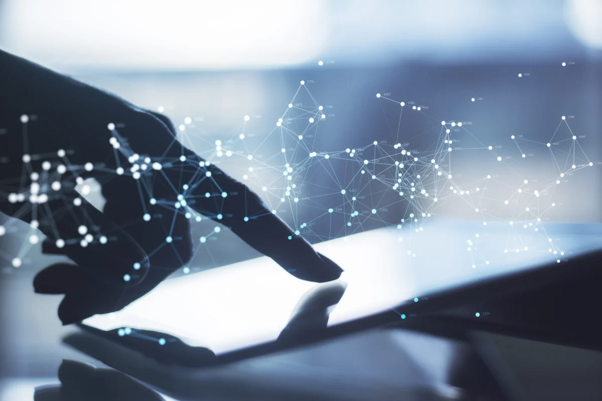 close-up-of-hand-using-tablet-at-desktop