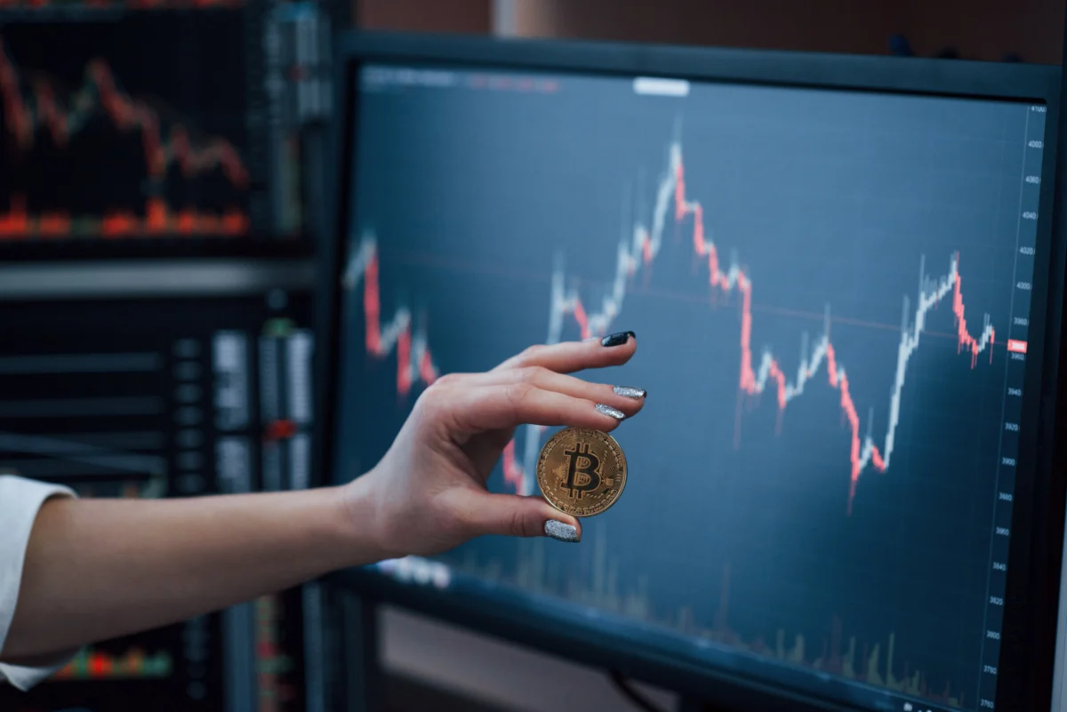 front-view-woman-s-hand-holding-bitcoin