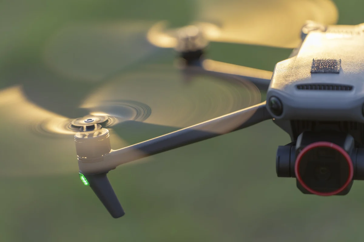 drone-technology-in-the-air-over-green-background.webp