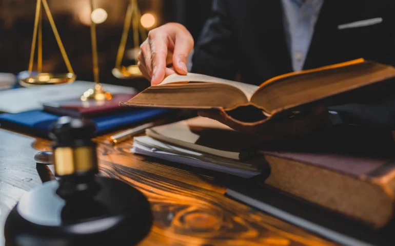 blurred-man-reading-law-book