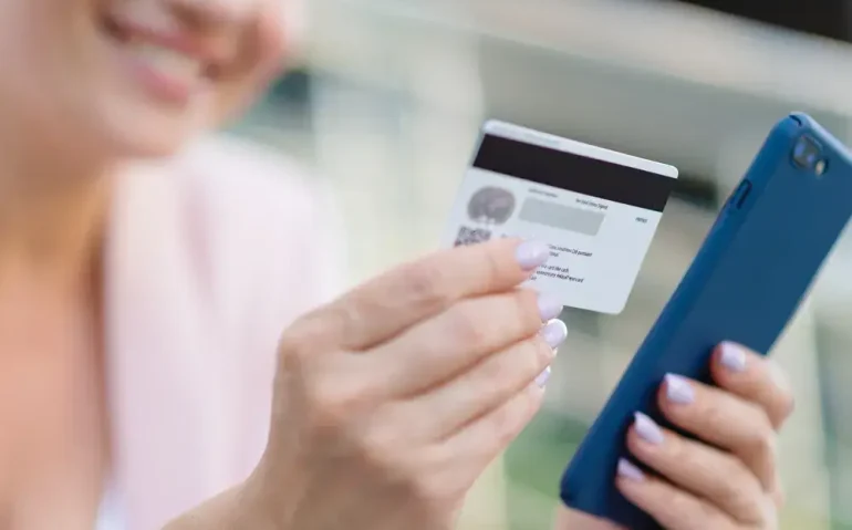 businesswoman-with-a-credit-card-and-phone businesswoman-with-a-credit-card-and-phone