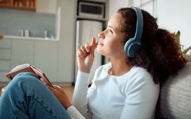 calm-woman-listens-to-music-while-resting