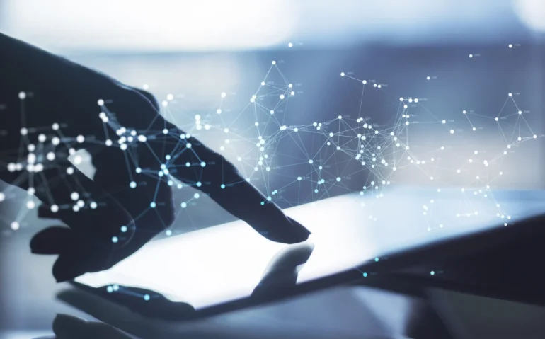 close-up-of-hand-using-tablet-at-desktop