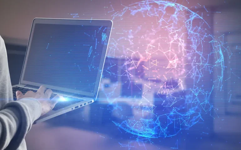 close-up-of-hand-with-laptop-and-abstract