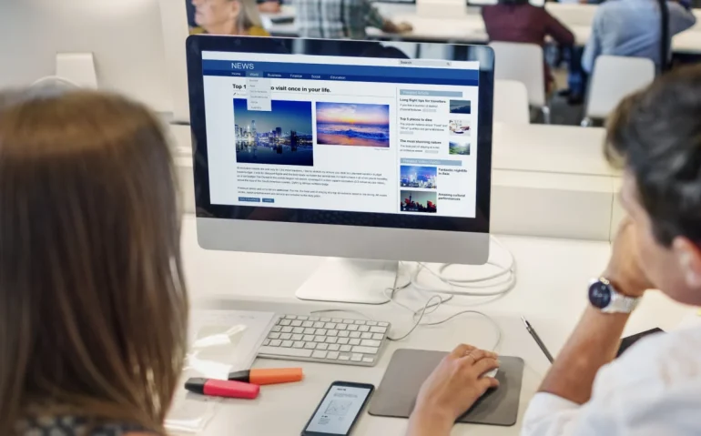 coworkers-reviewing-website
