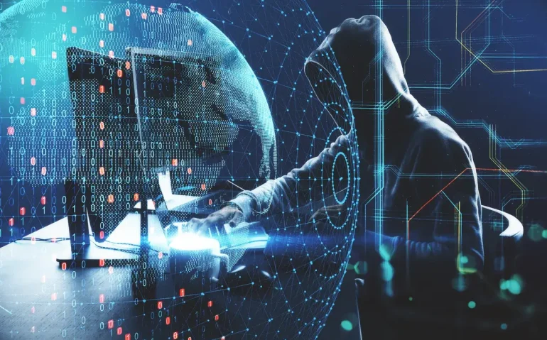 hacker-at-desktop-using-laptop-and-compute