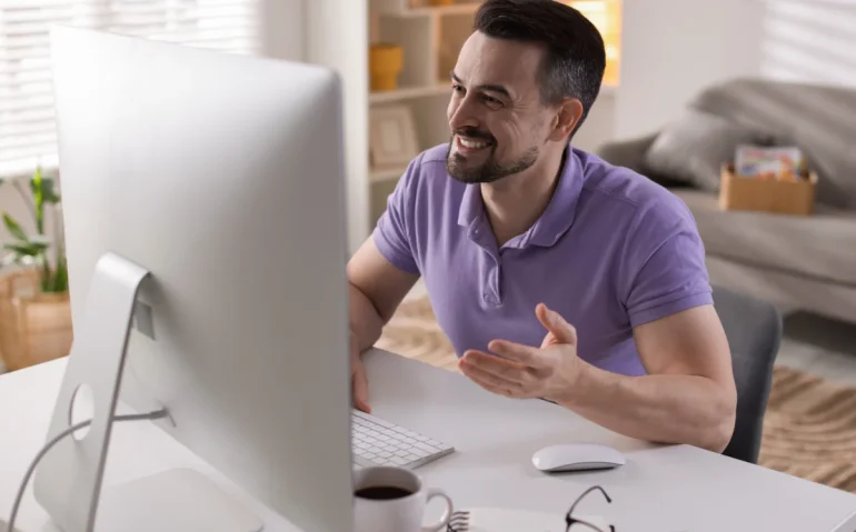 happy-man-having-videochat-by-computer