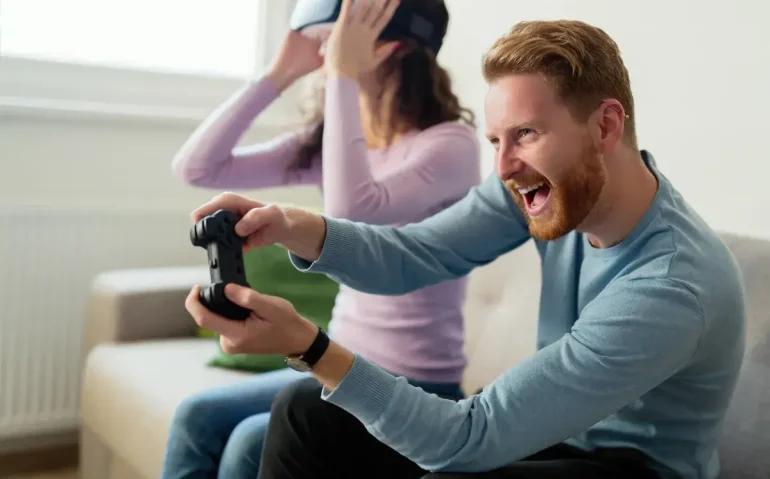 happy-young-couple-playing-video-games