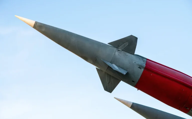 military-missiles-against-blue-sky-pointing