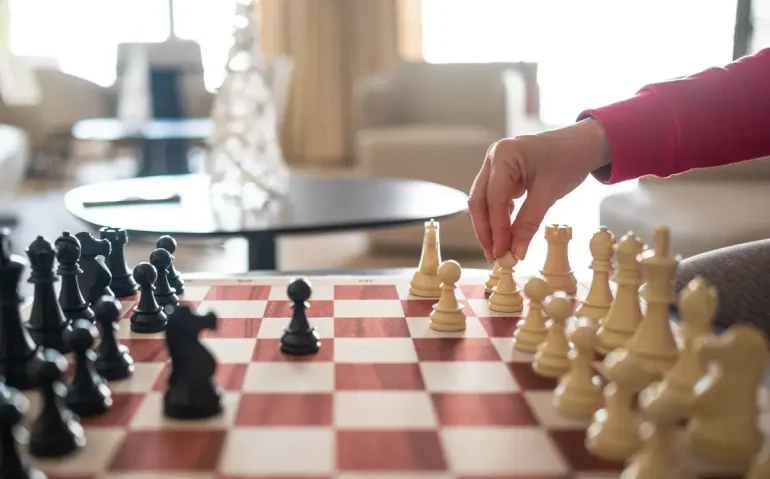 woman-playing-chess-game-making-a-strategic
