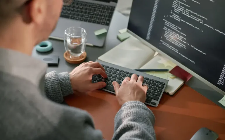 young-adult-caucasian-man-coding-software